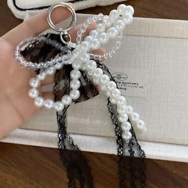 Koreai aranyos csipkével Meghajlás Csodabogár gyöngyös telefon Medál Futószalag accessor Esztétikai Balett cipők camer Olvasottság decoratie keychain Adomány