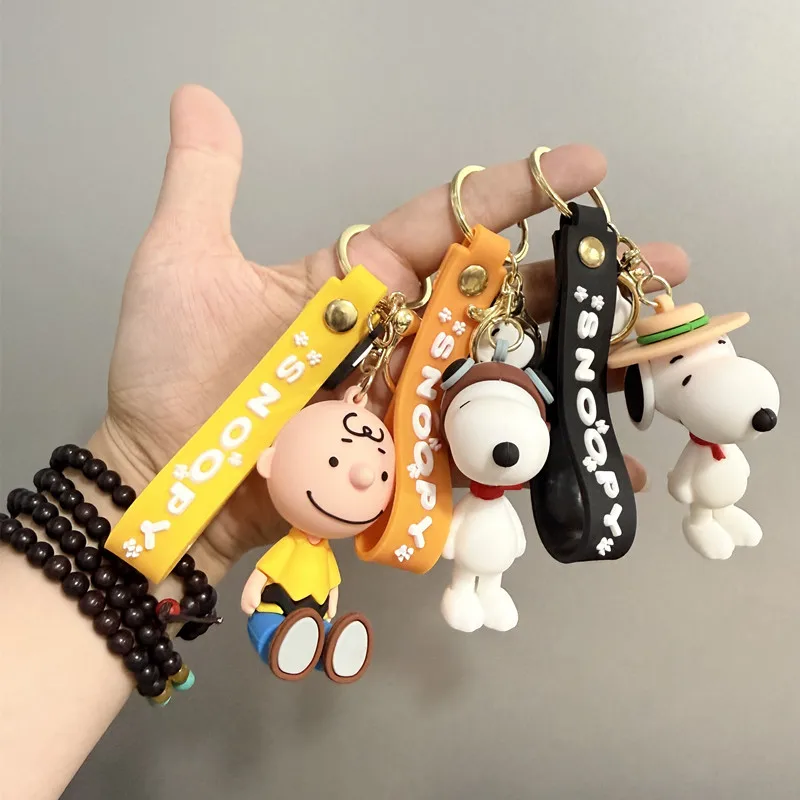 Cute and stylish new Snoopy cartoon dog design for 2026, can be used as a bag charm, backpack pendant, or car keychain.