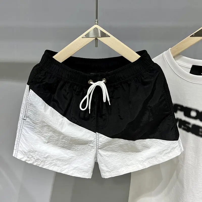 

Quick-drying trendy brand contrasting color splicing loose beach pants casual sports running three-point shorts men's summer