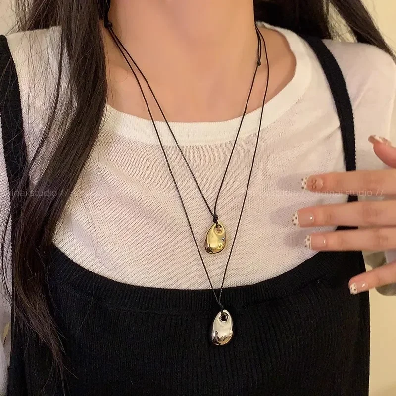 موضة المعادن الفول قلادة القلائد للنساء قابل للتعديل الأسود بولي Leather الجلود حبل سترة طويلة سلسلة القلائد مجوهرات اكسسوارات