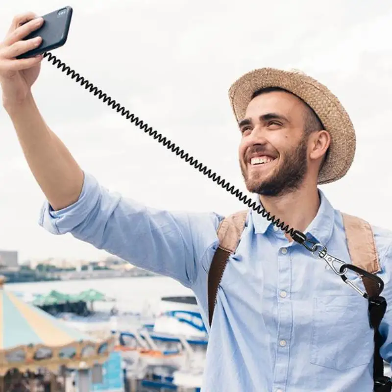 حبل هاتف عالمي قابل للتمدد مع رقعة - مضاد للسقوط لهاتف iPhone/Samsung/Pixel، مثالي للتزلج/المشي لمسافات طويلة/ركوب الدراجات