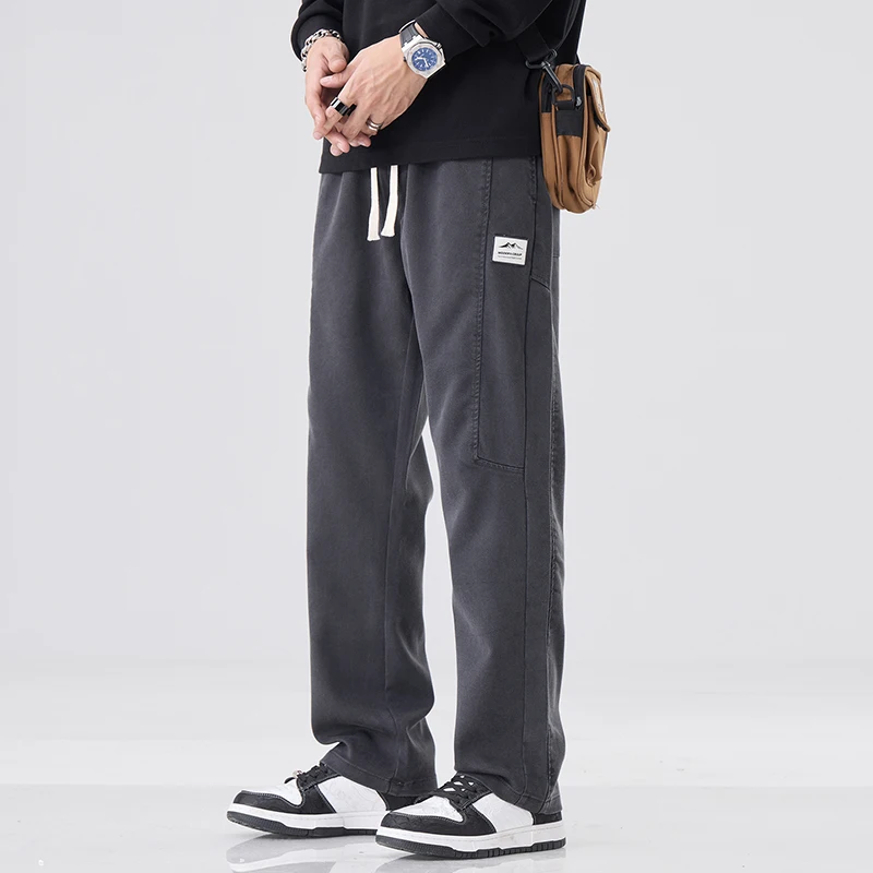 Pantaloni casual larghi da uomo nuovi autunnali Pantaloni sportivi larghi dritti alla moda coreana con coulisse Pantaloni maschili grigi neri caffè