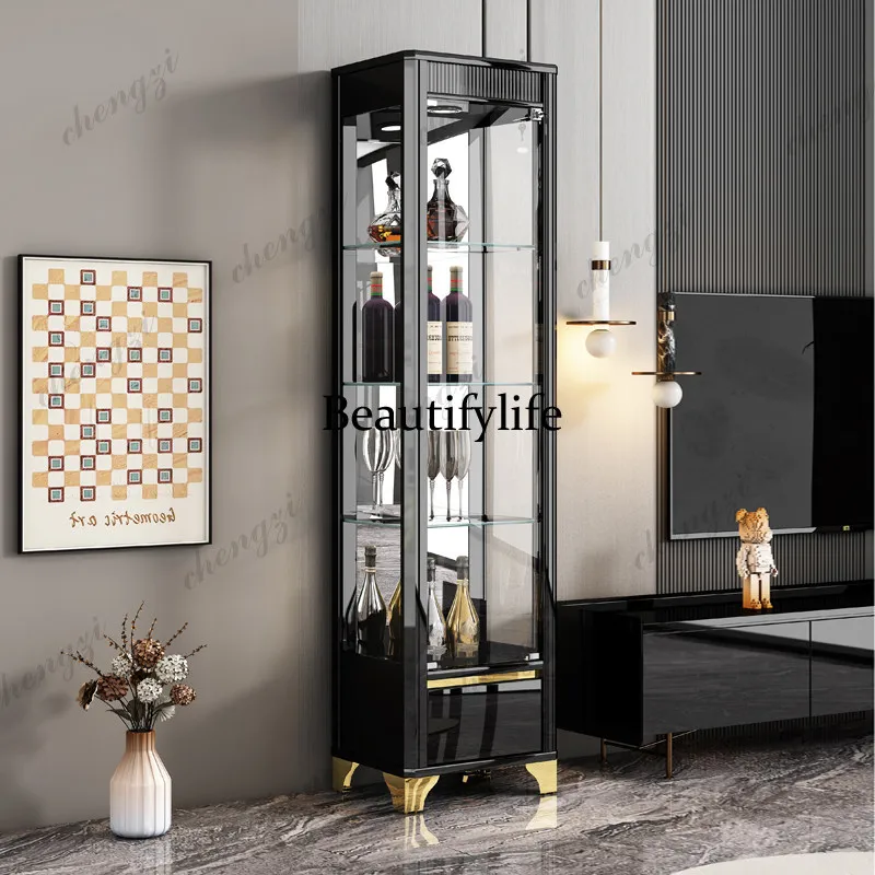 Glass wine cabinet against the living room wall, black lacquered wine cabinet, display cabinet with lockable glass doors