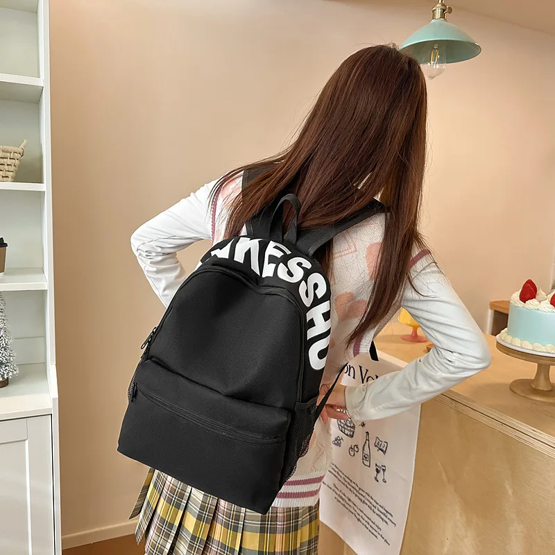 Lightweight Casual Backpack for Students Durable Nylon Daypack with Letter Print and Front Pocket for School Daily Use