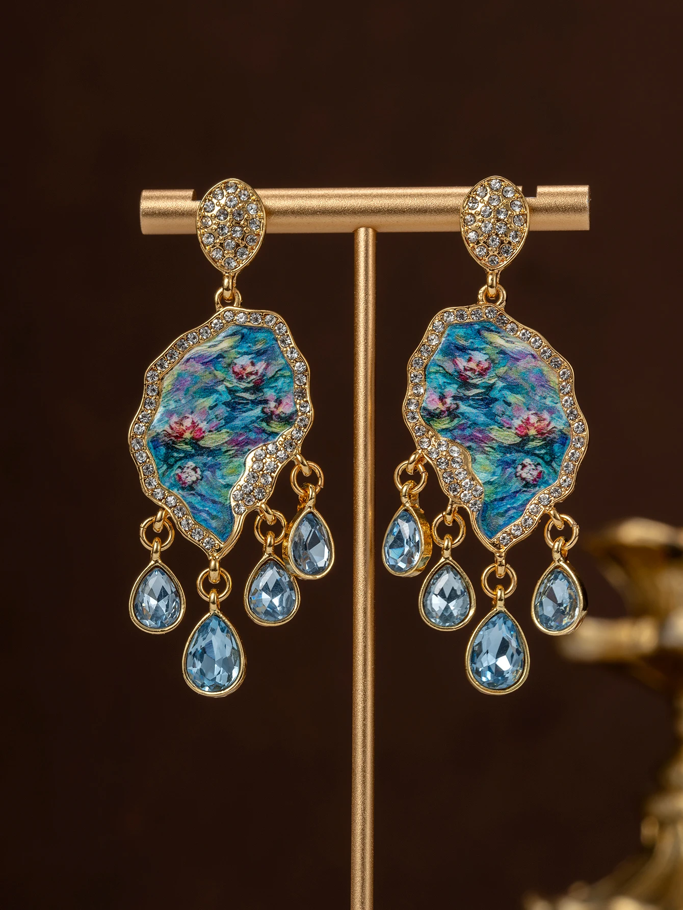 A pair of vintage Monet water lily oil painting earrings with diamond-encrusted blue water drop tassels for women's daily wear and gift giving