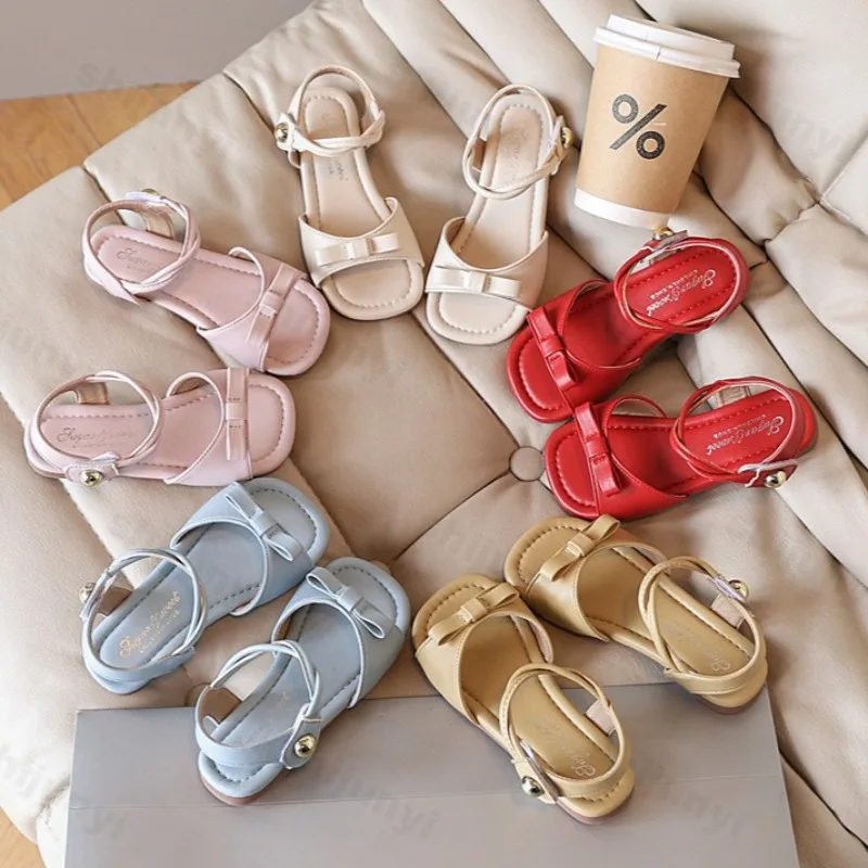 

Детские сандалии, летние милые сандалии с бантом, новинка 2025 года, сандалии принцессы на плоской подошве для девочек, модные повседневные корейские детские пляжные сандалии с открытым носком
