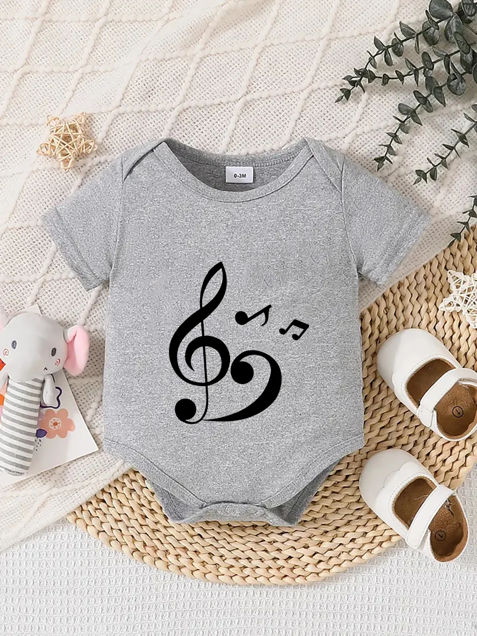 Playful letter-printed baby short-sleeve triangle bodysuit. Button closure for easy dressing, machine washable