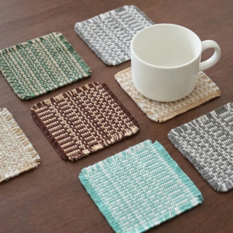 Vintage-inspired, tassel-trimmed woven coasters. checkered square fabric trivets, perfect for coffee, tea, and more