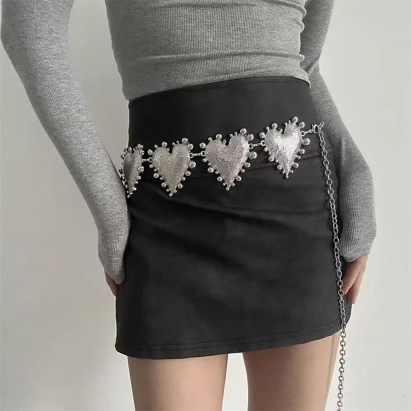 A high-end women's waist chain — a bold metal belt featuring an oversized heart design, adding a unique and stylish touch