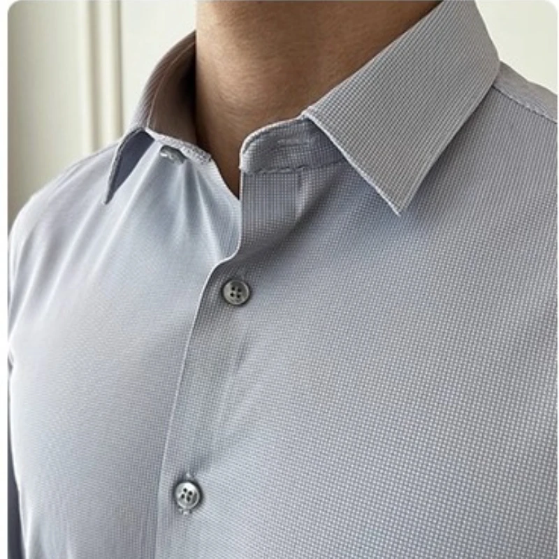 

Стиль старых денег ​ ​ ​ Мужская деловая рубашка без морщин — светло-голубая (разноцветная) M-4XL | Шелковая ткань, повседневная элегантность