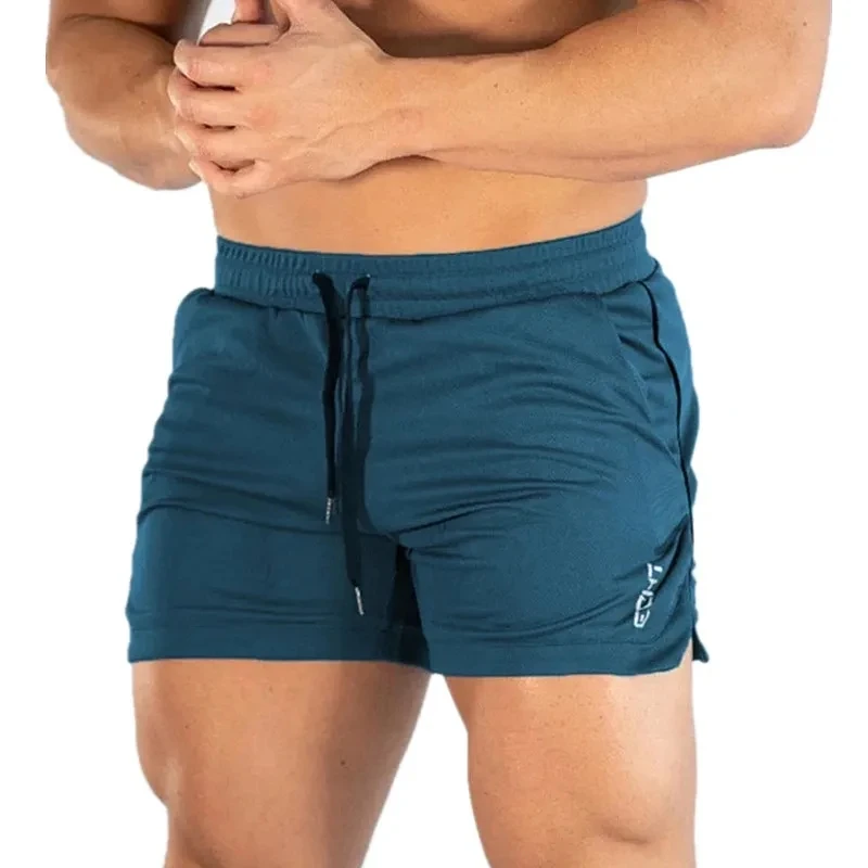 Calções esportivos masculinos de fitness, calções masculinos de treino de ginástica, calções de malha respirável casuais para praia, roupas esportivas masculinas novas, verão, 2023