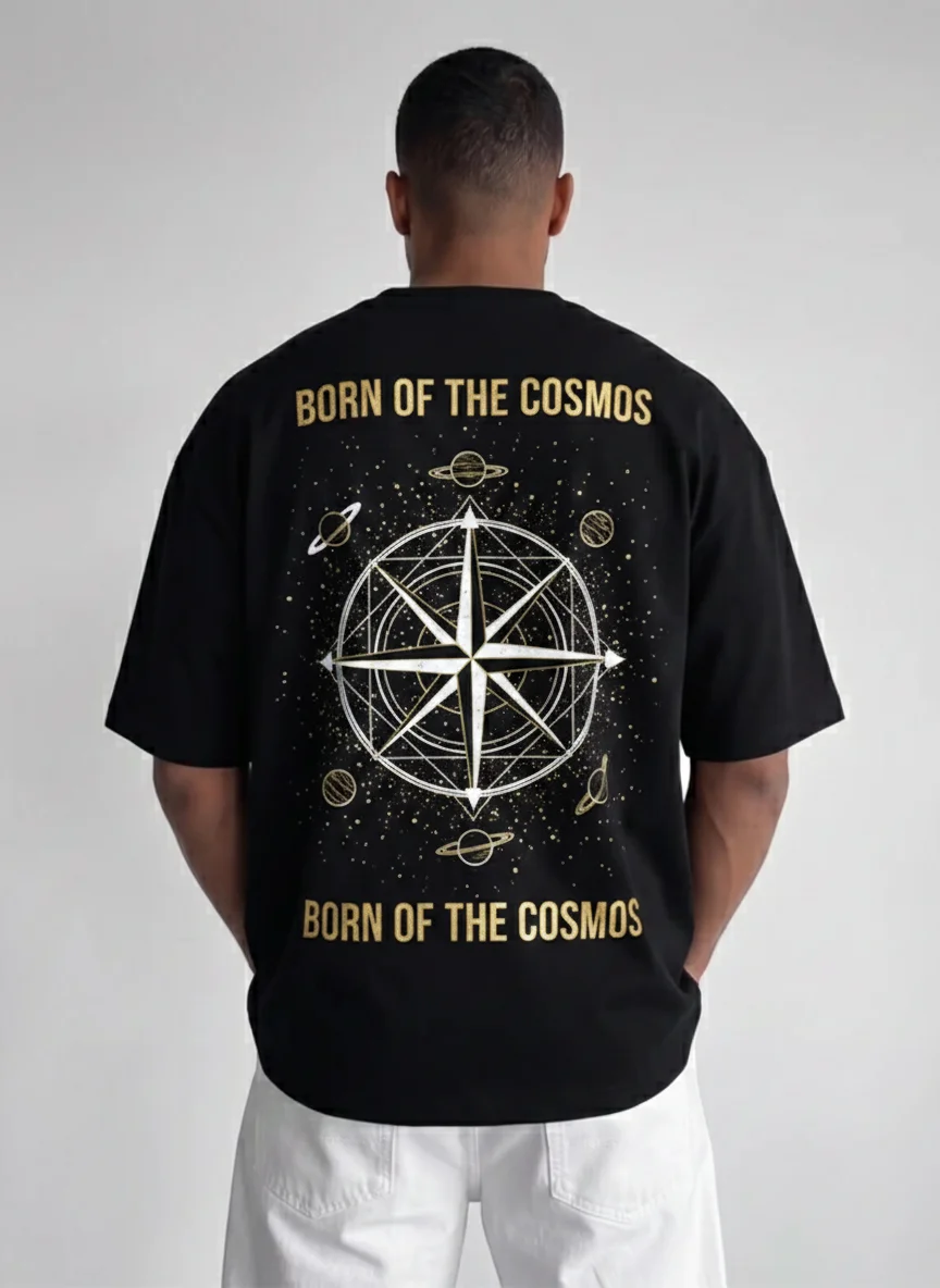 

Black Cosmic Compass Graphic Tee Born of the Cosmos Printed Tee with Gold Celestial Star and Orbit Planets Illustration