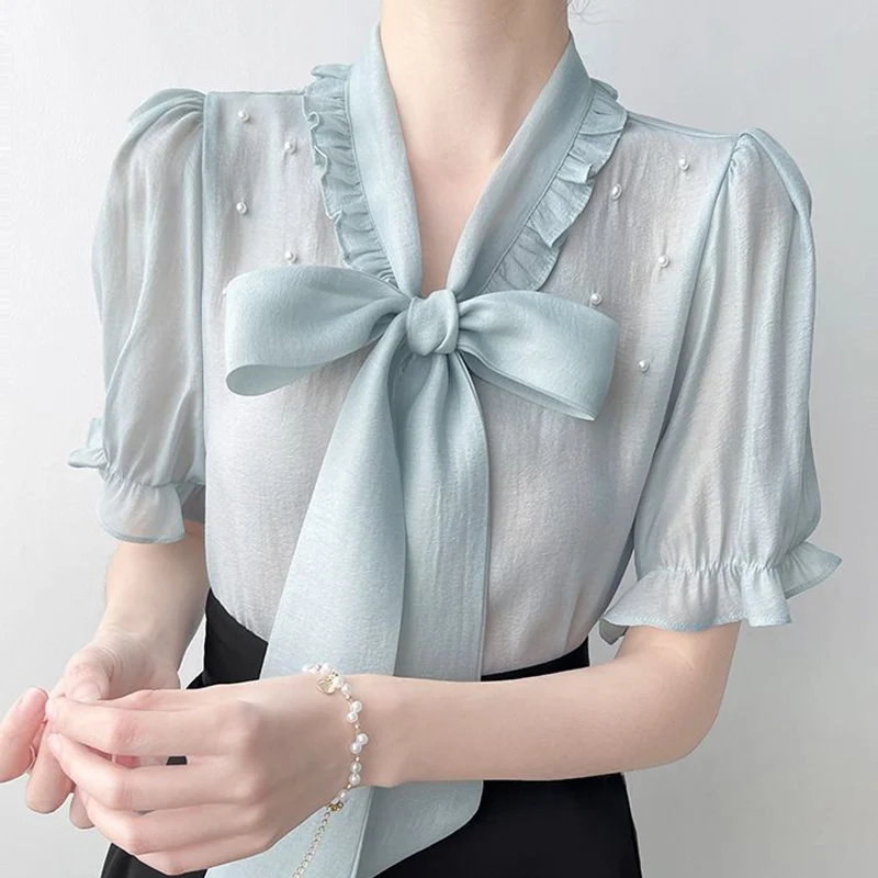 Verano moda coreana arco cordones bordado bengalas camisas 2025 nueva manga corta con cuello en V todo-fósforo volantes blusa mujeres Tops