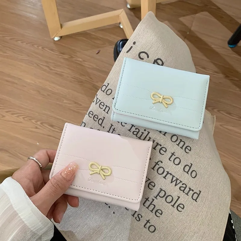 

Изысканный женский кошелек с бантом, простая корейская модель, короткая версия, оптовая продажа женских кошельков, студенческий кошелек со скидкой 30%.