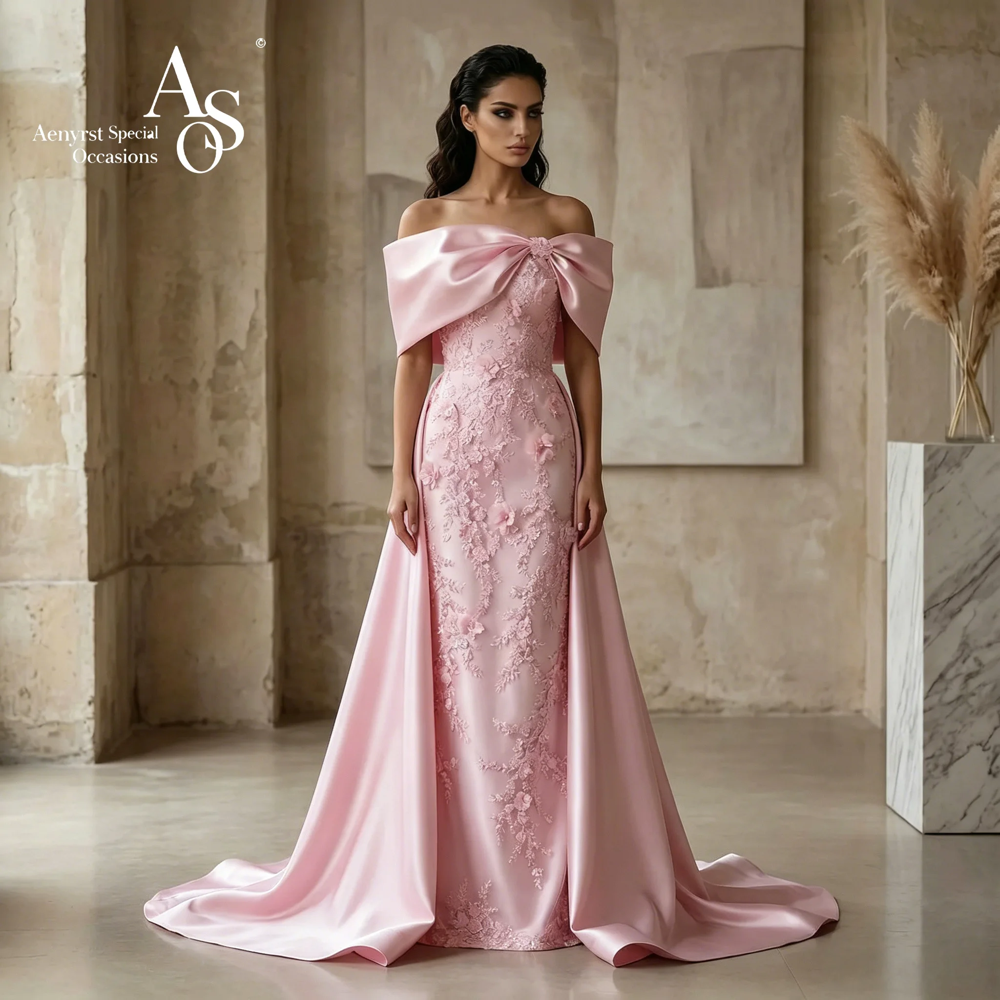 Elegant pink bow halter top with floor-length, waist-cinching evening gown