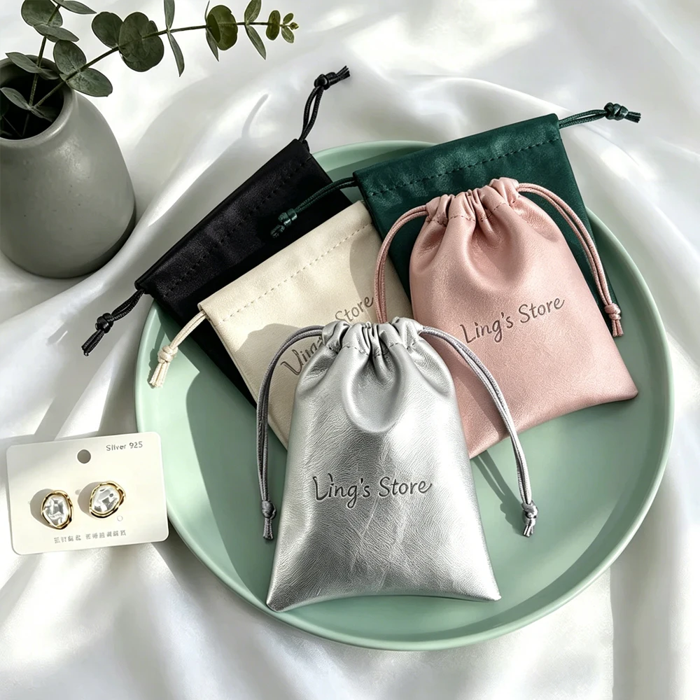 100pcs-custom-logo-silver-pu-leather-jewelry-drawstring-bags-wedding-favors-makeup-jewellery-ring-earring-bracelet-gift-pouch