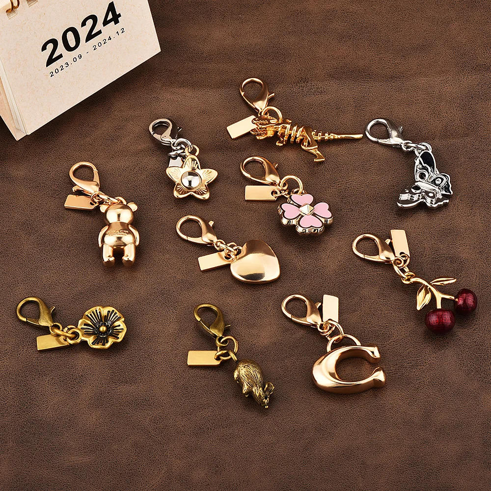 

Car key pendant, high-end bag accessory, golden bear, cherry, four-leaf clover, butterfly schoolbag accessory