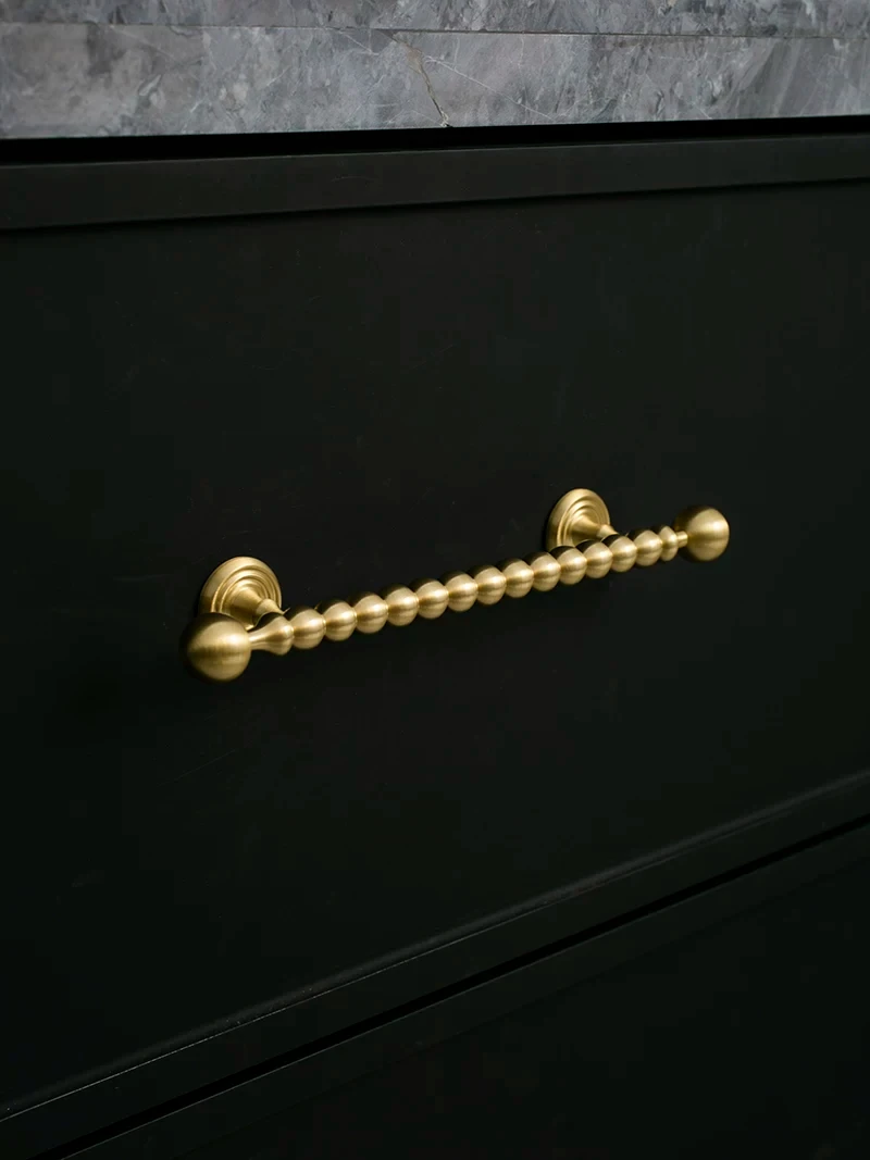 Beaded cabinet handle in brushed brass shown in the supplier product illustration 20