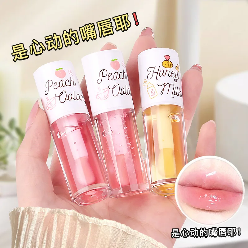 Fruit-scented lip oil moisturizing hydrating repairing preventing dryness and cracking caring for the lip area fading lip lines
