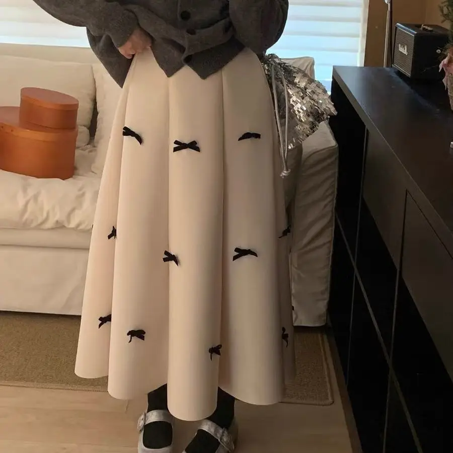 Autumn and winter new sweet bow skirt women's high waist thin A word big swing umbrella skirt medium and long thin cover meat