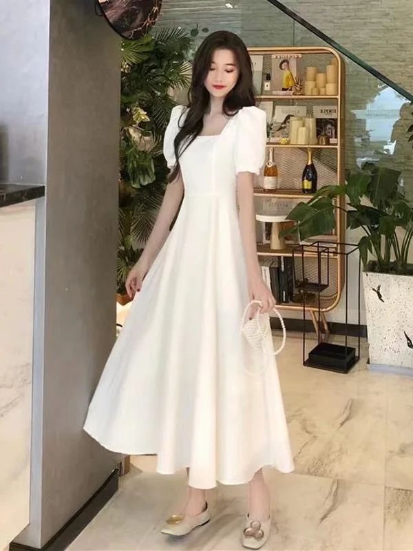 Gentle French retro Hepburn style long skirt looks slim and elegant with a waist cinched and bubble sleeves Women's dress HUS4