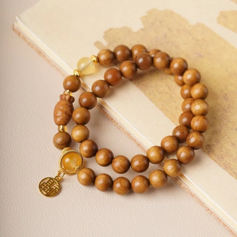 

Double-ring design golden nanmu water ripple bracelet, classic sandalwood style, unisex accessory for cultural and artistic purp