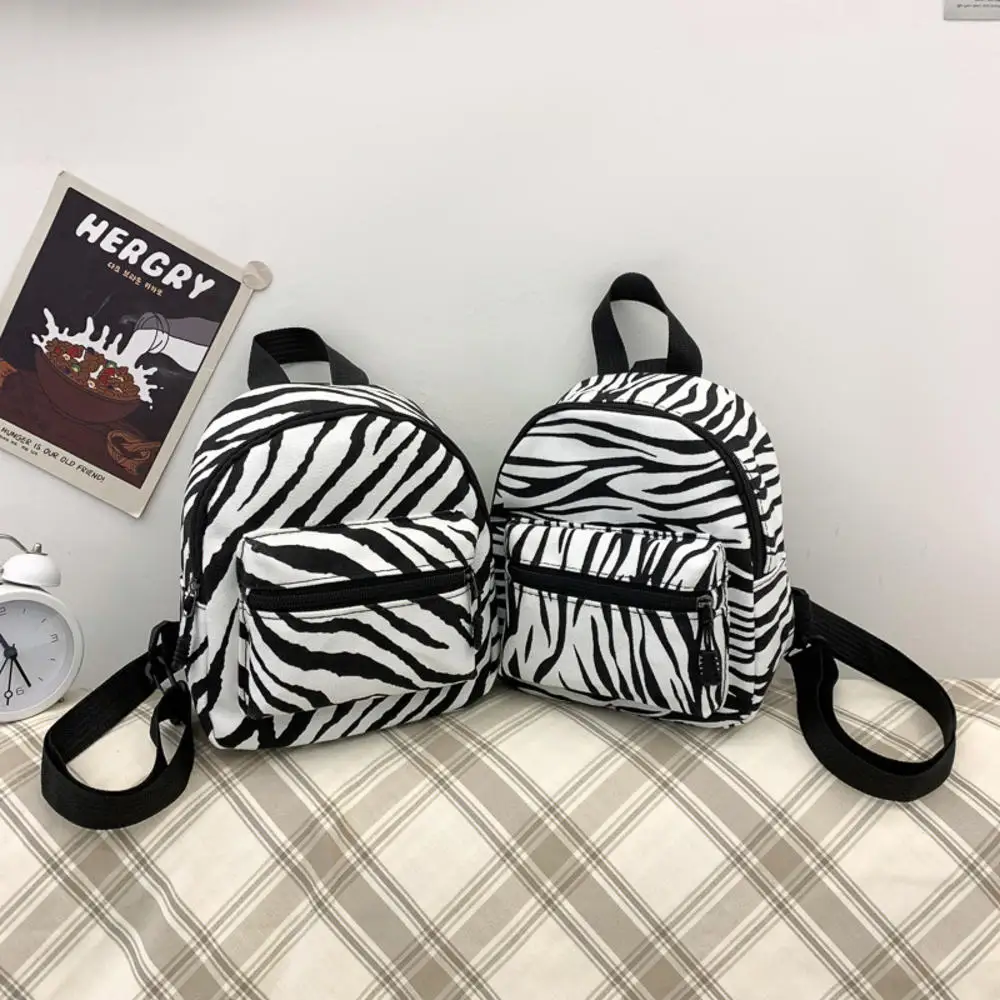 Mini mochila de nailon para mujer, bolso pequeño con estampado Animal, mochilas escolares para niñas adolescentes, novedad