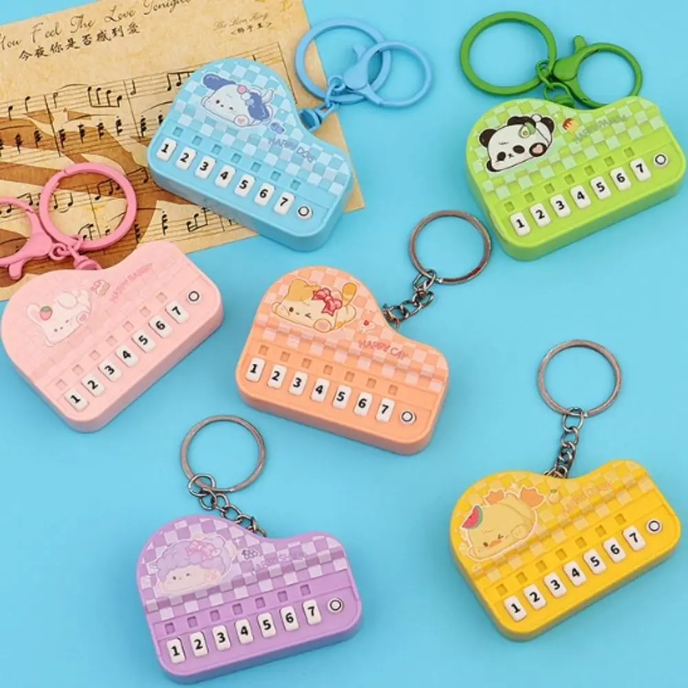 น้ําหนักเบา MINI ขนาดเครื่องดนตรีของเล่นสัตว์แบบพกพาคีย์บอร์ดอิเล็กทรอนิกส์พวงกุญแจปาล์มเปียโนกระเป๋าเป้สะพายหลังตกแต่ง
