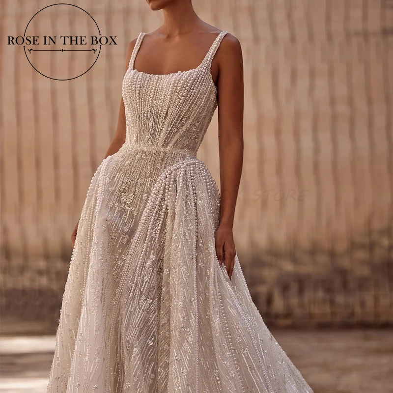 designer beaded dress NA25-G1651 FITTED DRESS WITH A SLIT FULLY BEADED DESIGN V-NECKLINE main image 0
