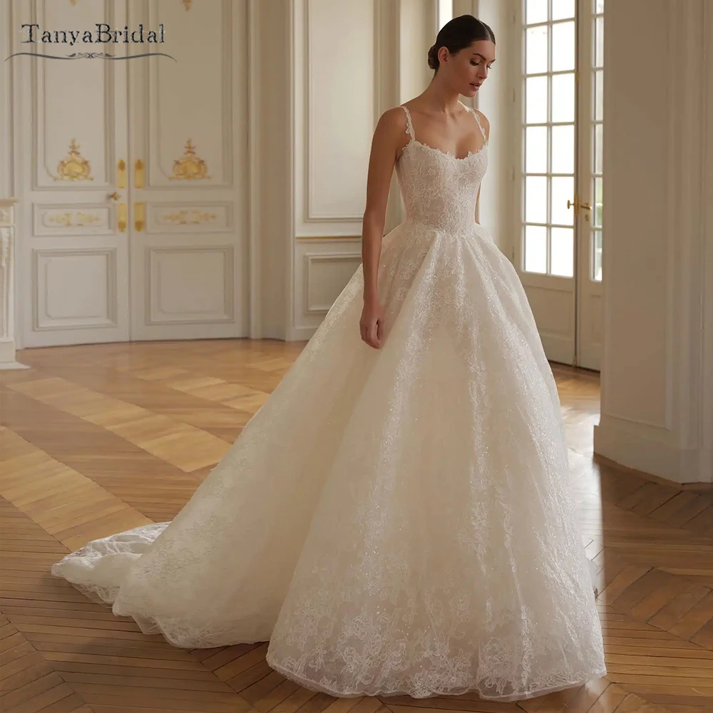 

Dramatic Wedding Dress featuring delicate straps and a semi-dropped waist, luxurious corded French Lace DW1101