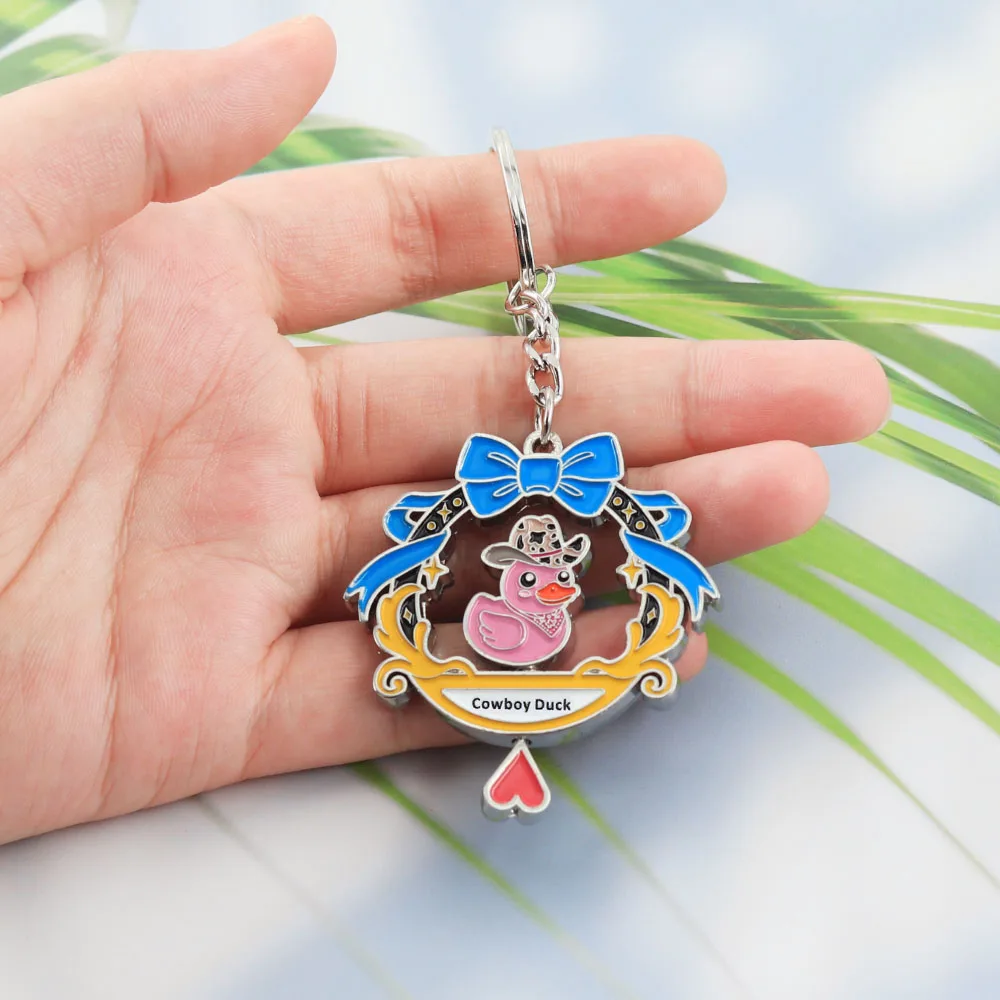 Lustiger rotierender Cowboy-Enten-Schlüsselanhänger, doppelseitig drehbarer rosa Enten-Schlüsselring, Kawaii-Tier-Metallanhänger, Schmuck für Rucksack und Tasche – Detail 3