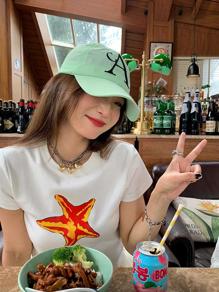 เสื้อยืดผู้หญิงลายพิมพ์ลำลองผ้าฝ้าย ดีไซน์ใหม่สุดฮิตประจำปี 2025 สีดำ