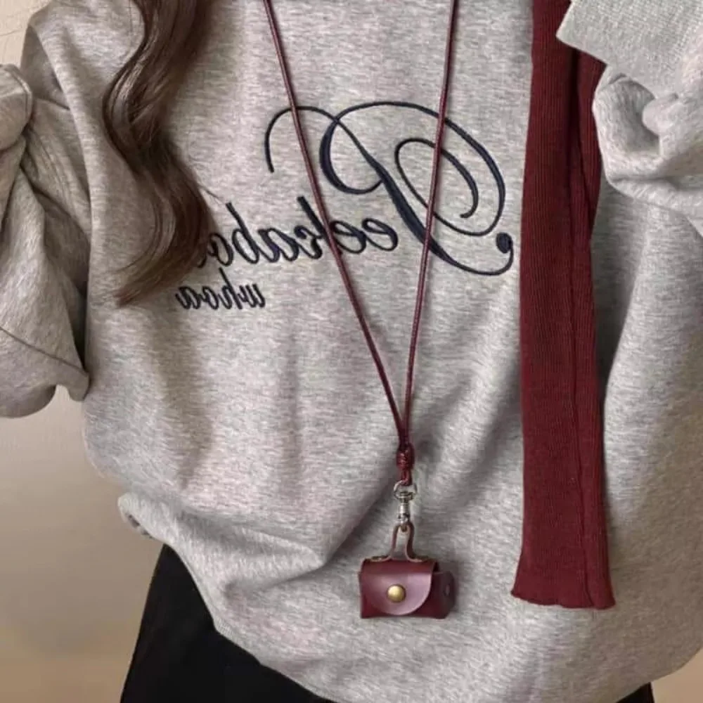 

Mini and Compact Leather Hanging Neck Coin Purse Gifts Pendant Long Sweater Chain Headphone Bag Women