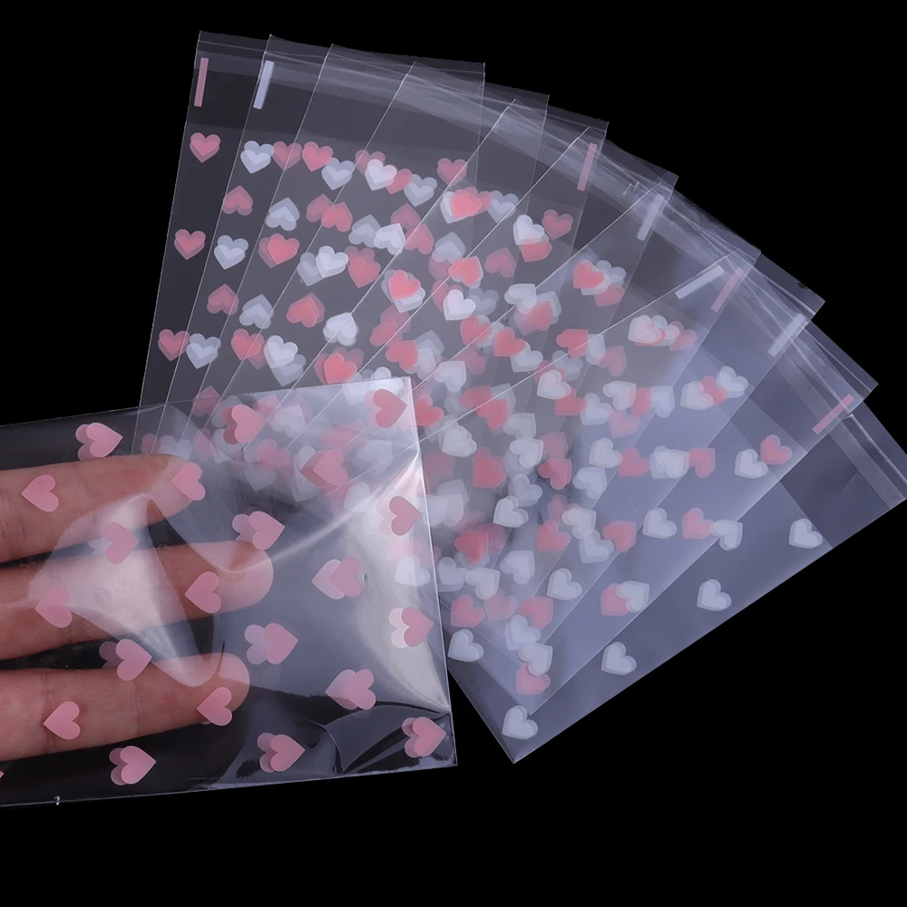 50 Stück transparente, selbstverschließende Beutel in Herzform, OPP-Aufbewahrungsbeutel für DIY-Schmuck, Ohrringe, Armbänder, Süßigkeiten, Kekse, Geschenke, Verpackungsbeutel