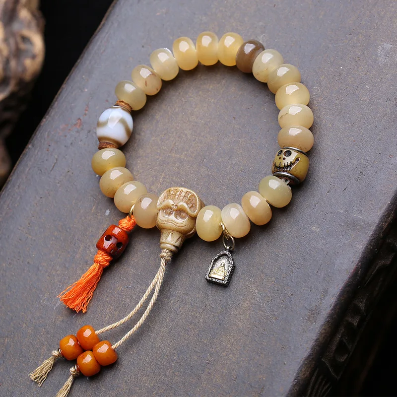 Single-Loop Horn-Shaped Bead Bracelet With Hetian Jade, Panda Agate, Dzi Beads, And Guanyin Figurine Made From Recycled Bone