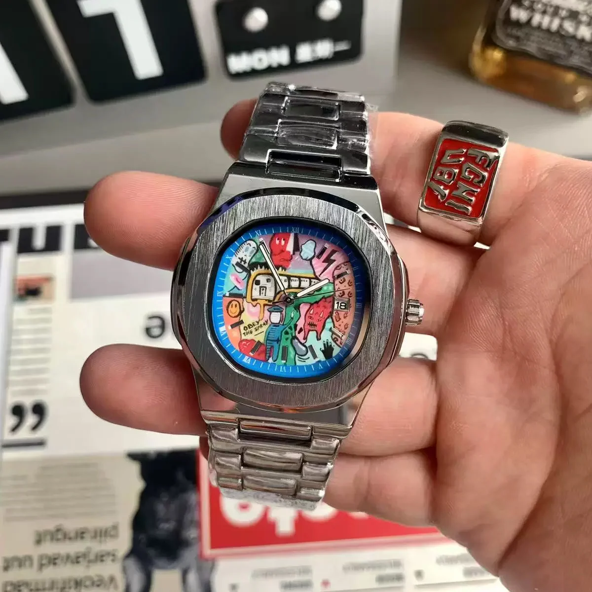 New retro square graffiti watch for men, featuring anime-style pixel graphics on ins, with a high-end and niche look. It has a s