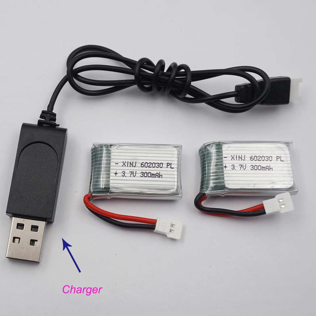 

XINJ Charger+2pcs 3.7V 25C 300 mAh Rechargeable Polymer Lipo Li Battery 602030 Cell For DFD F182 F183 H8C Syma X5 FY530 RC Drone