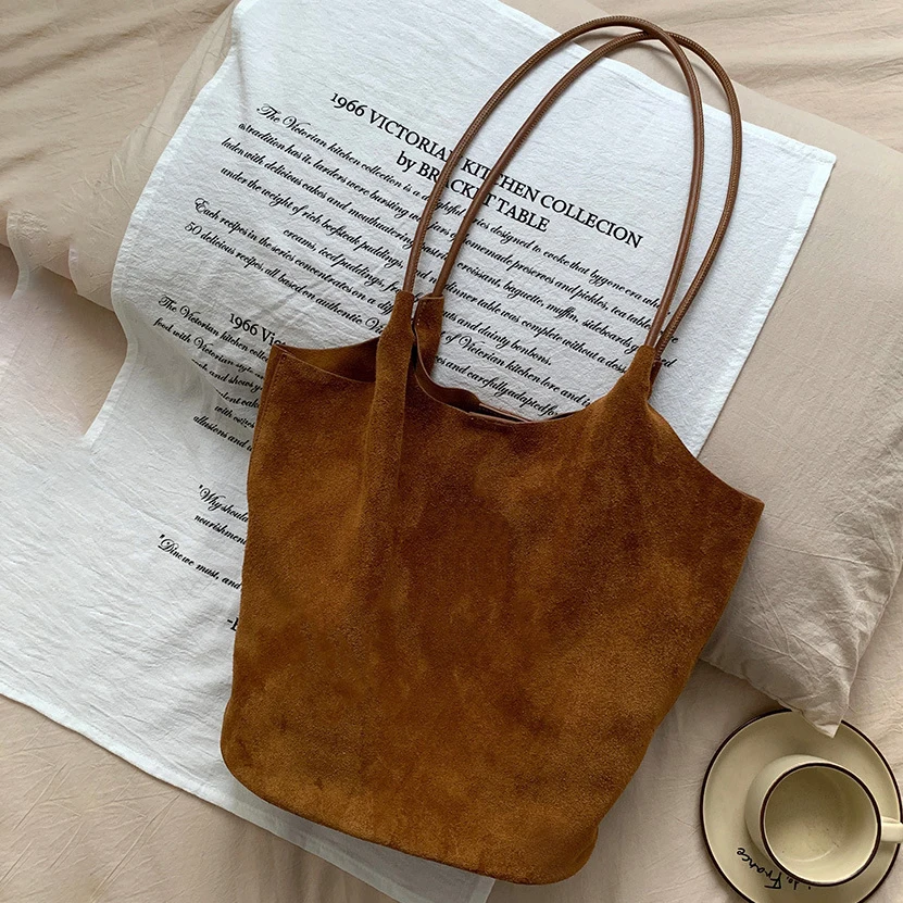 

Suede tote bag autumn and winter new niche design large capacity frosted cow leather vintage handheld shoulder bag women's bag