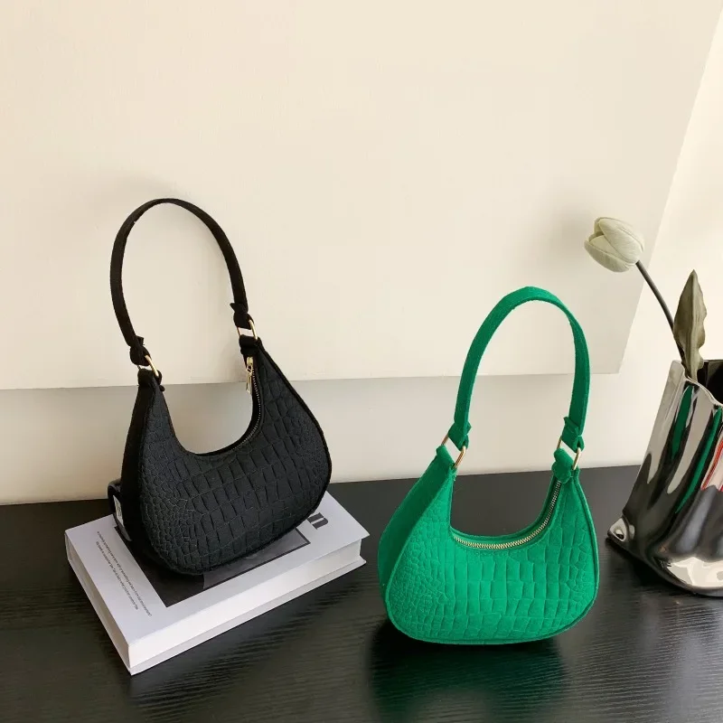 Nuevo bolso de mano de Color sólido para mujer, versión coreana de moda del nuevo bolso de hombro de ocio con patrón de piedra de verano