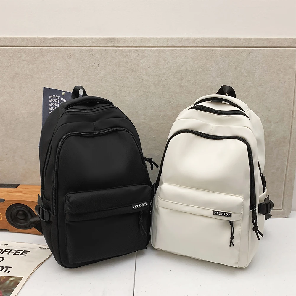 Mochila de color sólido de gran capacidad para estudiantes de secundaria Mochila de viaje negra simple y duradera para adolescentes de secundaria