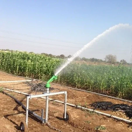 farm field agriculture  high pressure water irrigation system rain spray metal sprinkler head automatic turn