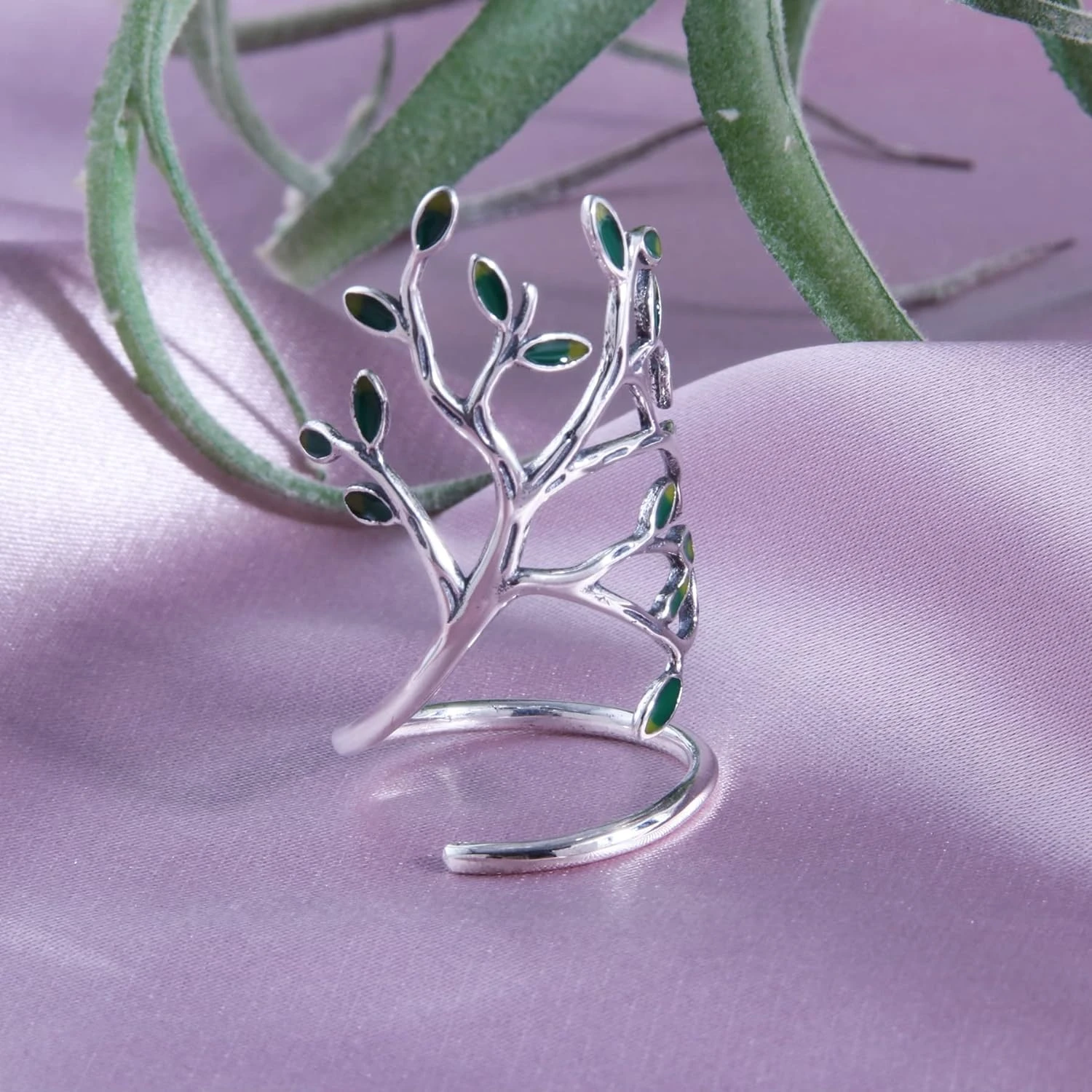 

Contemporary and elegant, the exquisite Tree Of Life open ring by innovative designer Helen de Lete is crafted in sterling silve