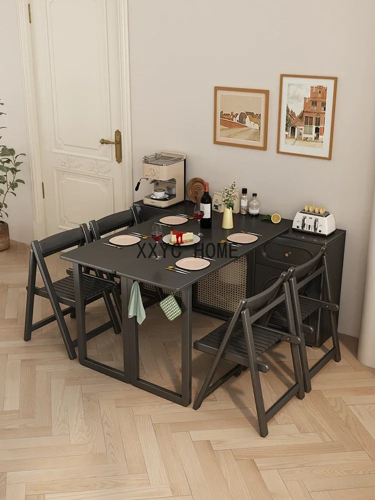 

French folding dining table with integrated wall support and adjustable rotation