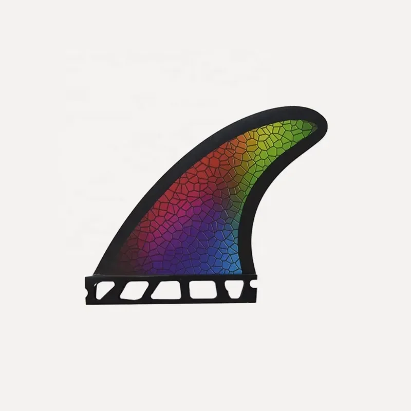 High-performance custom colored short board fins for use on black and red surfboards