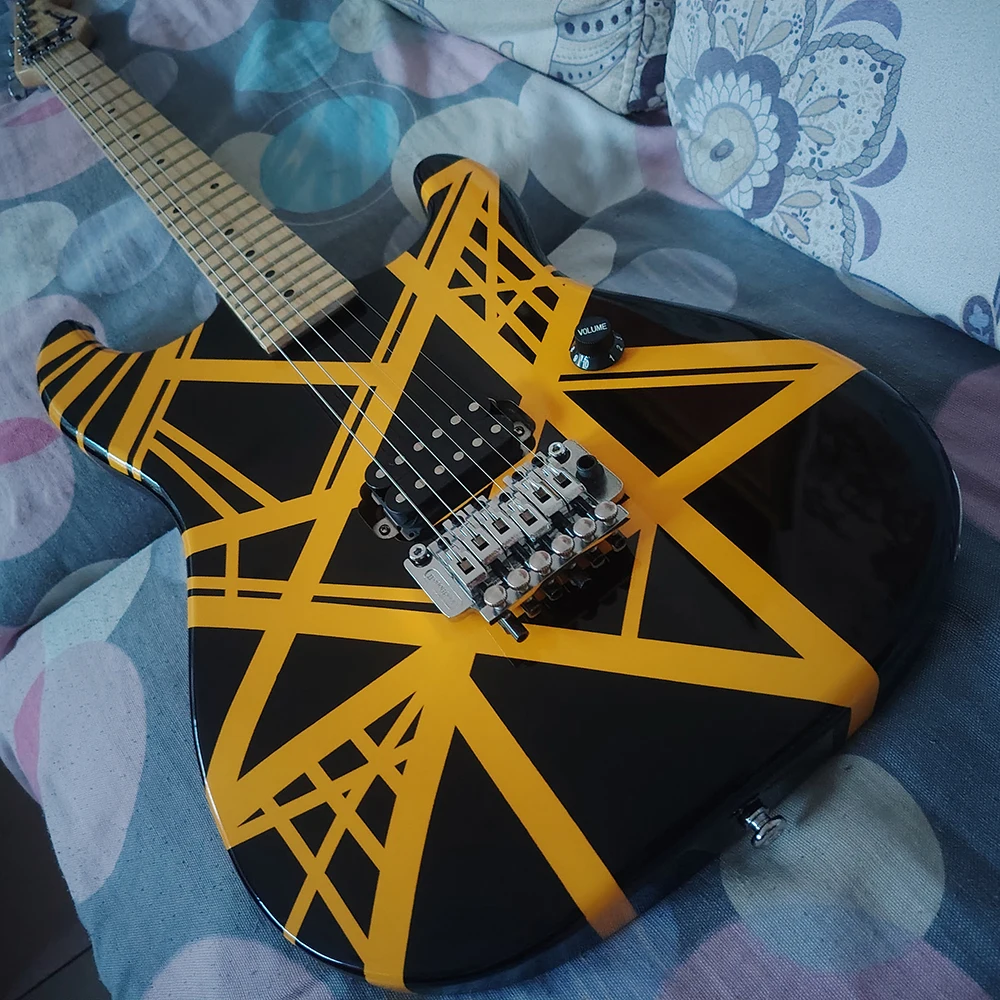 High quality yellow and black line electric guitars in stock, select the fastest shipping method according to the buyer's addres