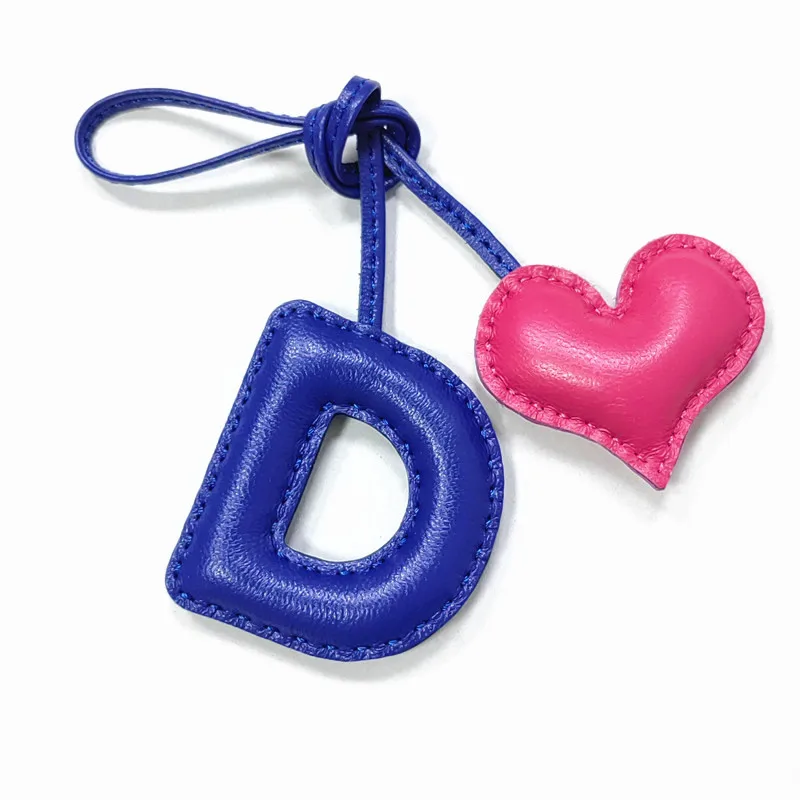 Genuine leather D with heart-shaped letter style bag decoration with pure handmade stitching, high-end car keychain accessories