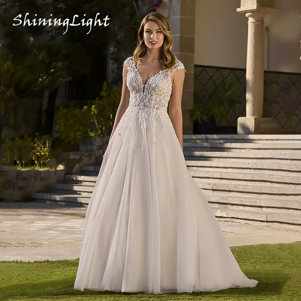 

ShiningLight A-line Tulle Wedding Dress 2026 V-Neck Lace Appliques Backless Ivory Boho Bridal Gowns Vestidos De Noiva Customized