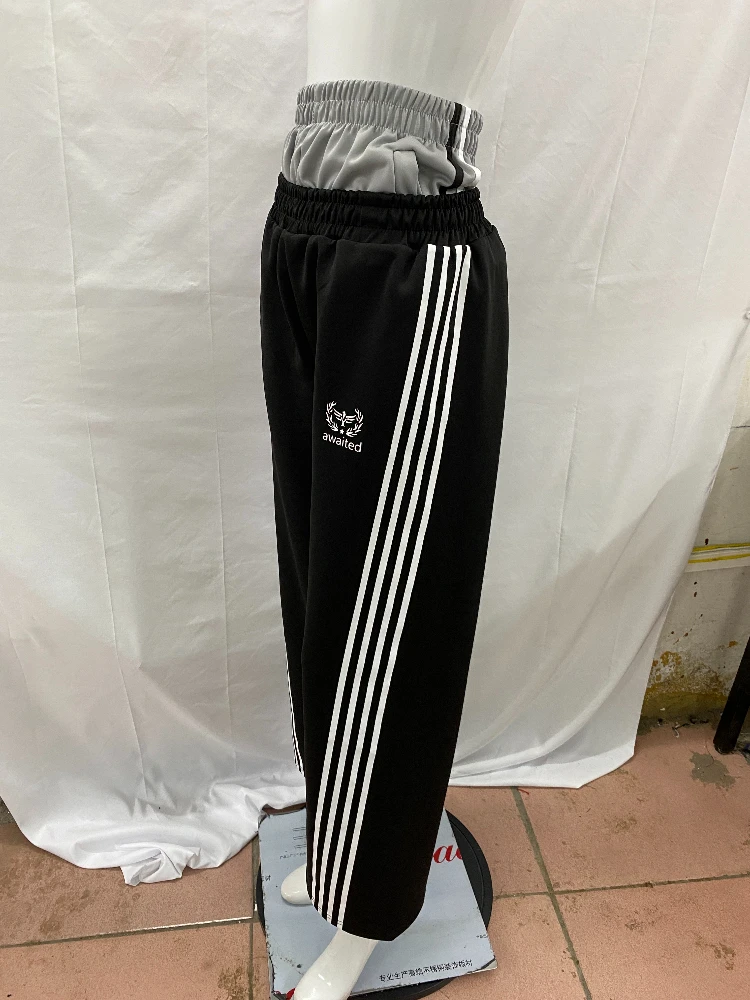 

Double waisted fake two-piece long pants with dark Gothic embroidery pattern, color blocked fashionable couple