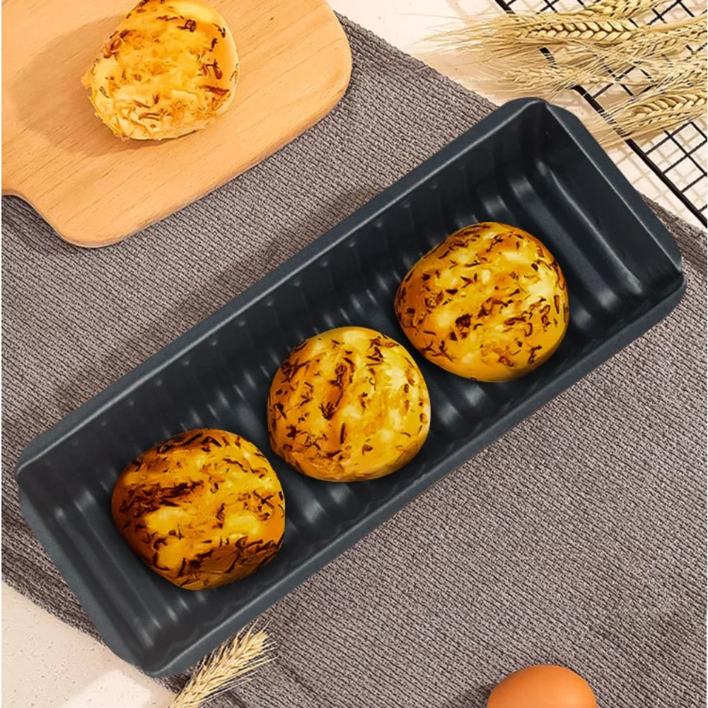 Reliable Carbon Steel Wavy Bread Pan Used for Baking Multiple Types of Bread Including Dense and Light Varieties