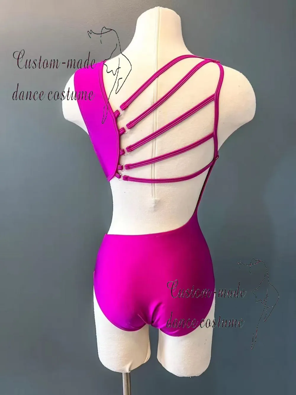 Magenta performance leotard, suitable for gymnastics or stage performances, featuring a geometric cut design.